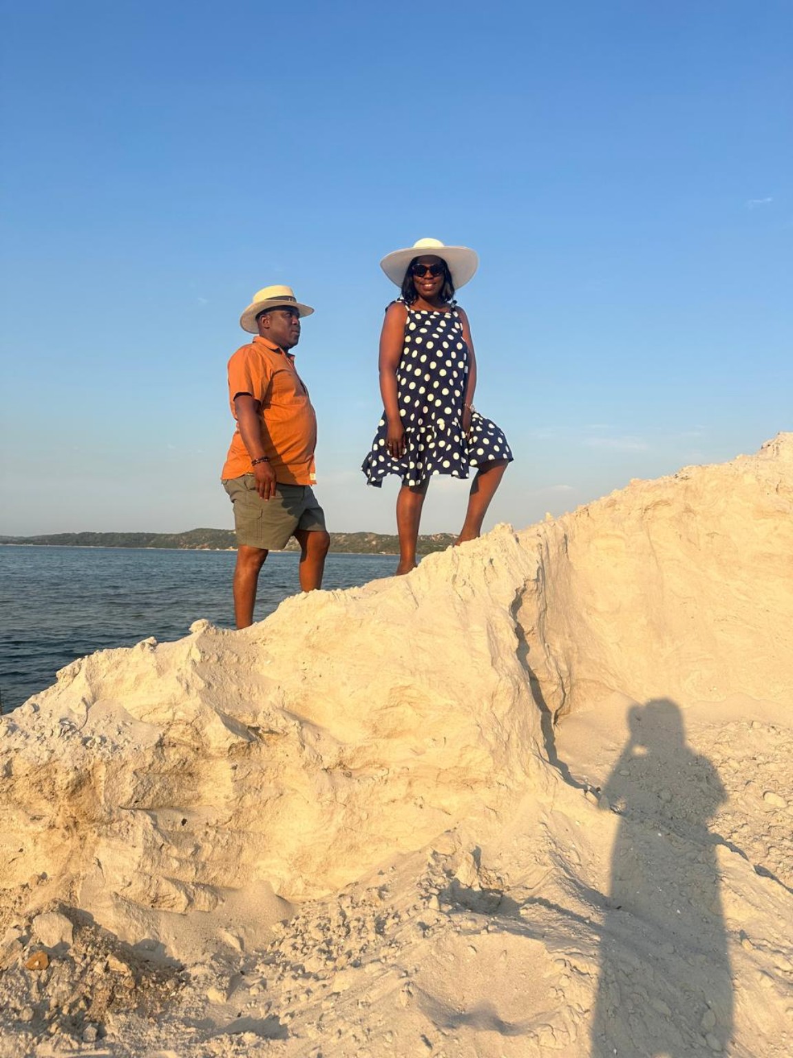 A couple taking in the shoreline during a beach getaway